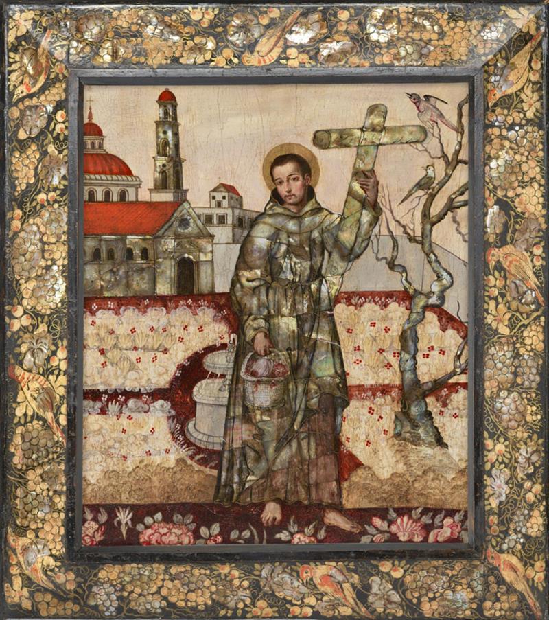 A byzantine-style painting of the saint wearing robes holding up a cross in one hand and a bucket in the other. He is standing in front of a church. The frame is painted with botanical images.