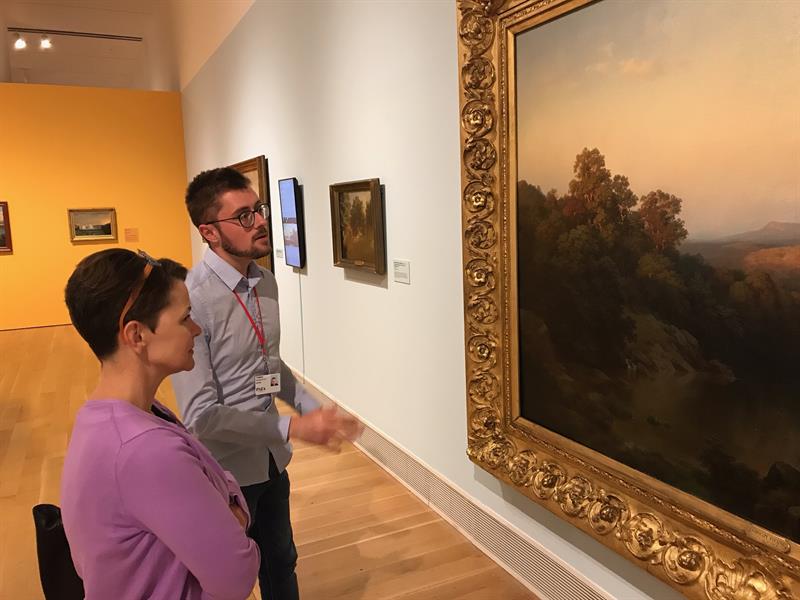 Thomas Busciglio-Ritter and Professor Wendy Bellion look at a Paul Weber painting.