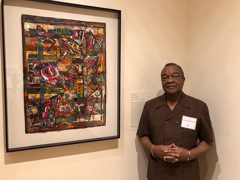 David C. Driskell stands next to his artwork "Shaker Chair and Quilt" (1988) at the Bowdoin College Museum of Art.