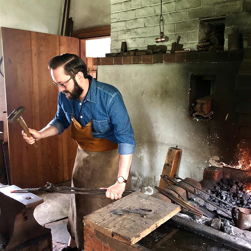 Michael Hartman Forging Iron at the Old Salem Blacksmith 