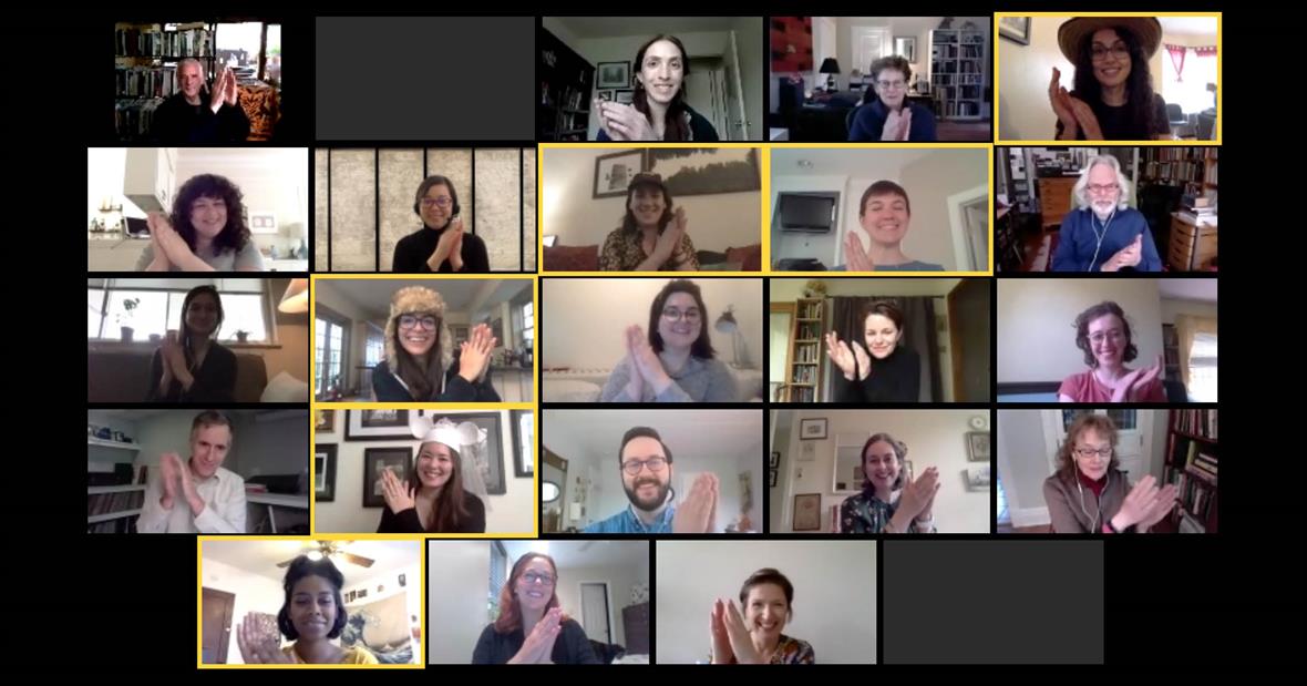 A screen capture of a Zoom call. All atendees clap to celebrate award recipients.