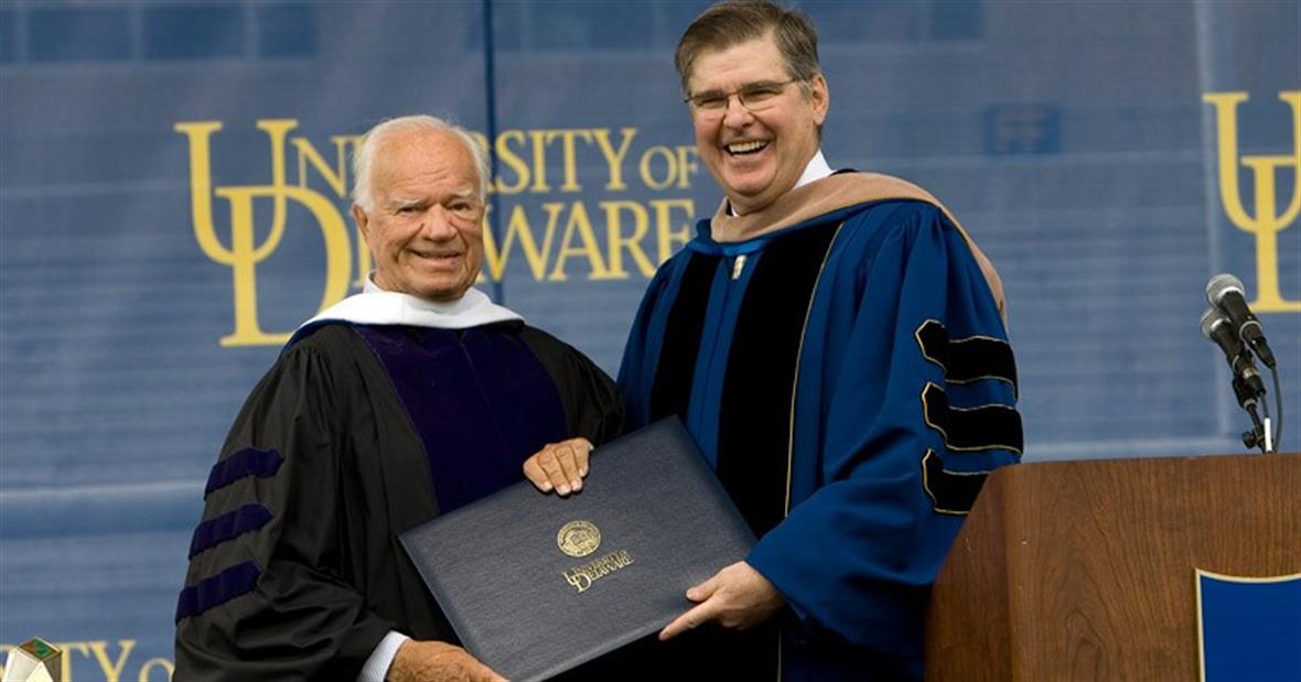 Wayne Craven (left) receives an honorary Doctor of Humane Letters degree from Board of Trustees Chair Howard Cosgrove. 